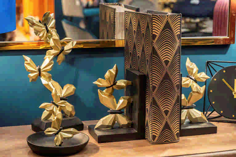 SUJETALIBROS MARIPOSAS DORADAS 12x10x19 CM